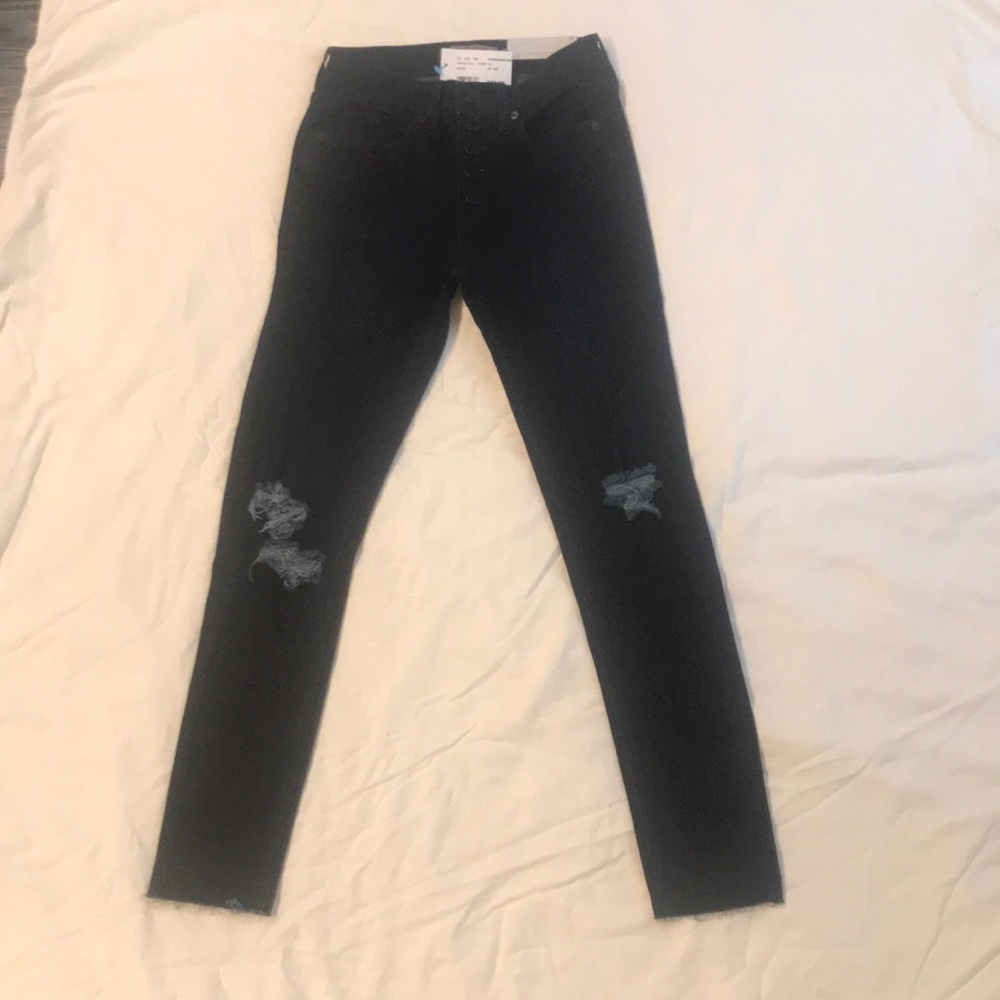 dark wash blue ripped jeans